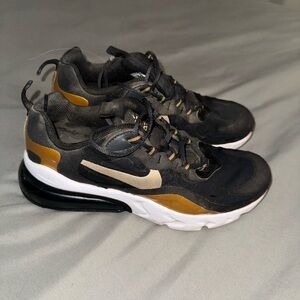 Nike Kids/Women’s Black and Gold Sneakers